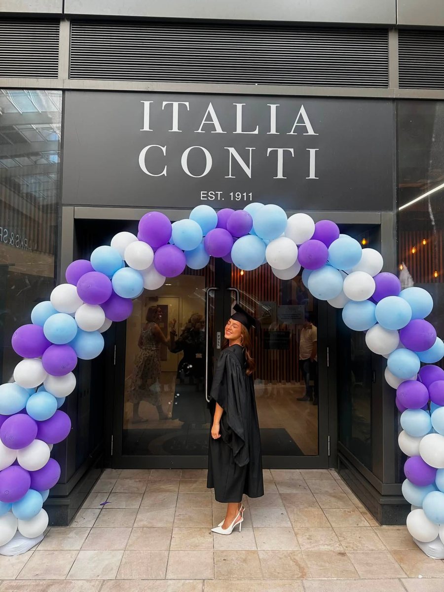 Ella, Tycoons alumni dancer, in her graduation gown outside Italia Conti in London
